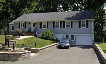 Exterior view of Chatham Group Home with a car parked in the driveway